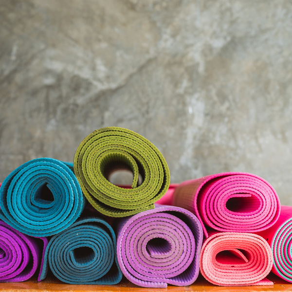 Pile of colourful yoga mats